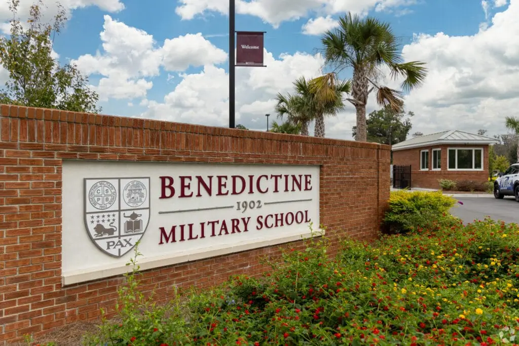 Benedictine Military School building exterior with red brick facade and white columns in Savannah, GA.