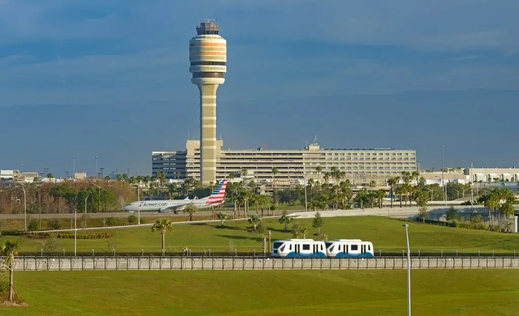 Orlando International Airport North Terminal with modern architecture and clear blue skies, showcasing its expansive design.